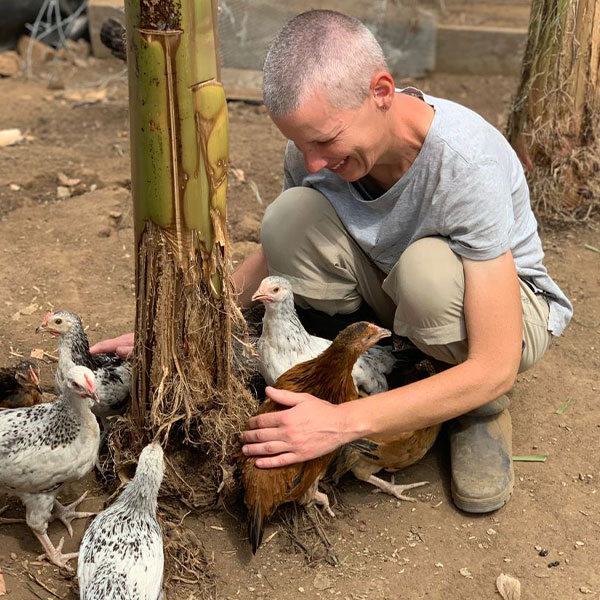 Poultry farming in Uganda | Christina taking care of the chickens